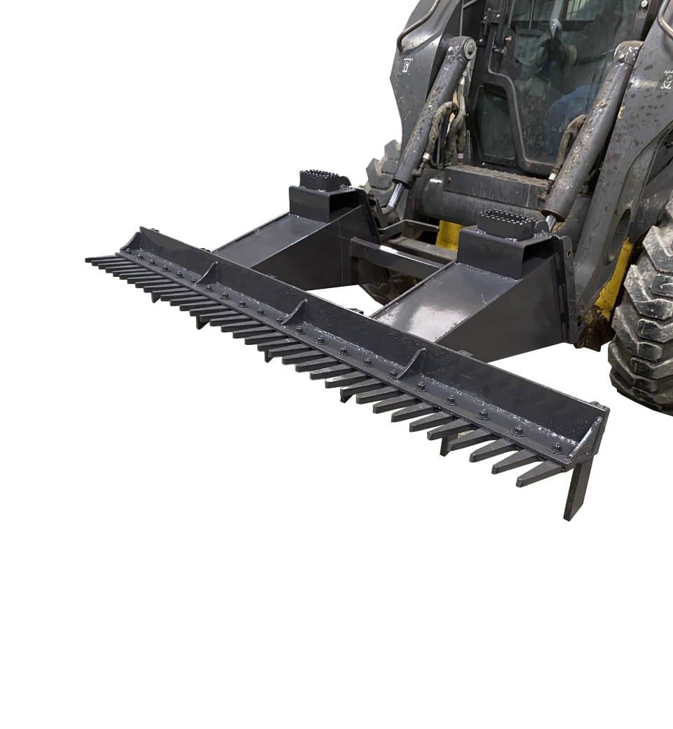 Image of the Skid Steer Eliminator, a heavy-duty grading and leveling attachment, mounted on a skid steer loader. The attachment features sharp teeth designed for breaking up soil and smoothing surfaces.