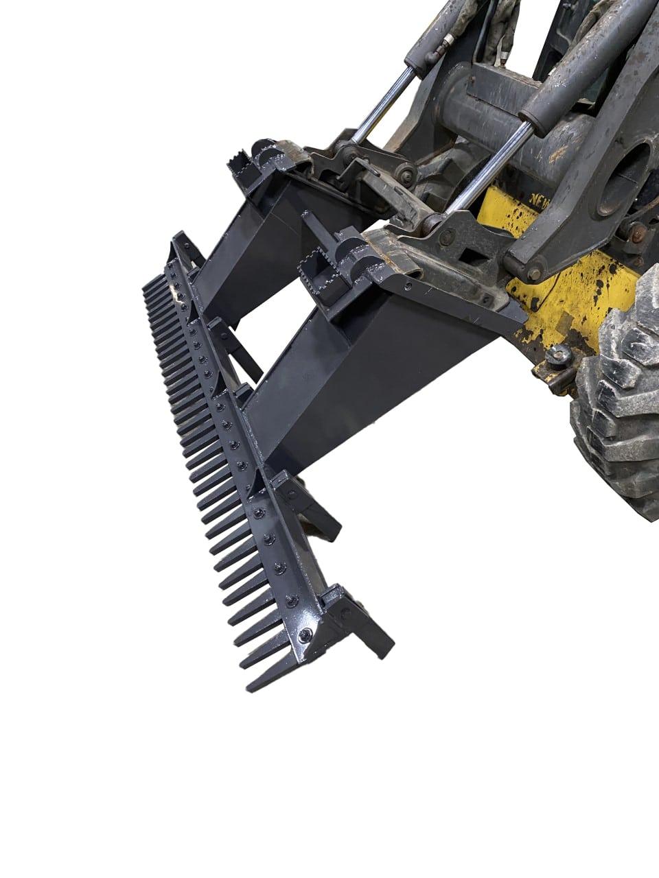 A heavy-duty attachment with metal prongs and hydraulics is showcased, designed for tasks like land clearing or brush removal. The Skid Steer Eliminator is mounted on a yellow and black skid steer, making it perfect for tough jobs.