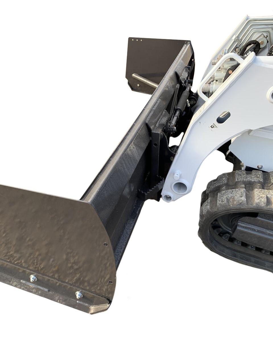 Close-up of a white skid steer loader with a black Small Skid Steer Snow Push attachment featuring a blade, designed for pushing materials or scraping surfaces. Only part of the vehicle's body and tracks are visible.